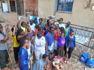 Members of Hope Social Union for the Visually impaired standing with their white canes